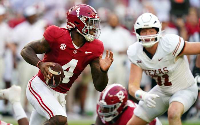 Sep 9, 2023; Tuscaloosa, Alabama, USA; Alabama Crimson Tide quarterback Jalen Milroe (4) scrambles out of the packet against the Texas Longhorns during the first quarter at Bryant-Denny Stadium. Mandatory Credit: John David Mercer-USA TODAY Sports